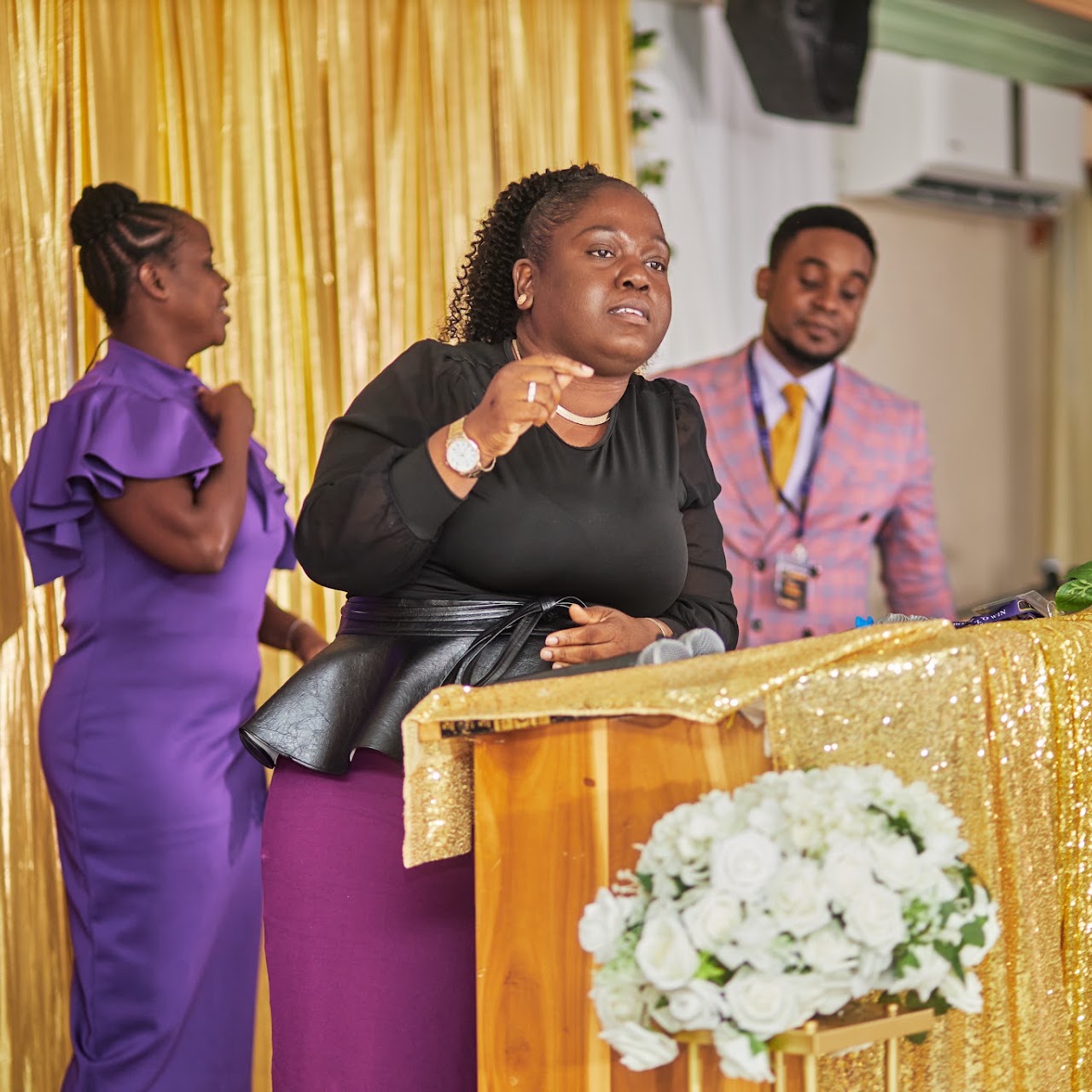 Women worshipping together at a W.I.N. conference